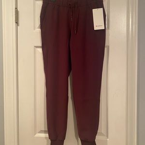 Lululemon joggers. Wine colored. Brand new with tags. Size 6.